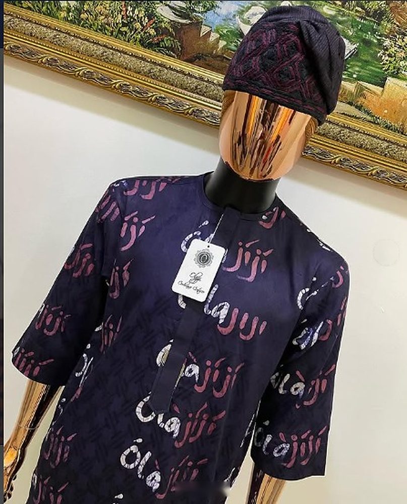Midnight-navy senator shirt with rose and silver Olajiji script print on a copper-head mannequin